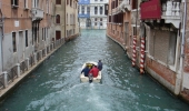 Admire the famous Venetian canals