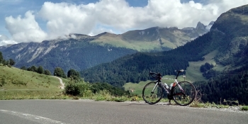 Enjoy the view while riding up Col de la Colombière pass to win your polka-dotted jersey