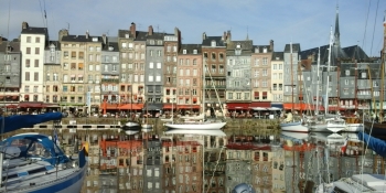 The charming harbor of Honfleur is on your way from Bayeux to Rouen